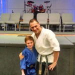 Simon earns 1st Degree Karate Black Belt